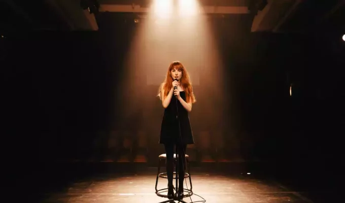 Singer under a warm spotlight