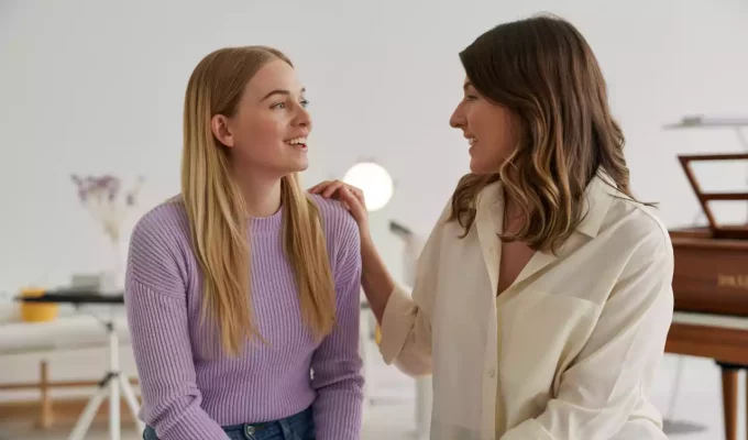 Vocal coach guiding young singer through basic vocal techniques